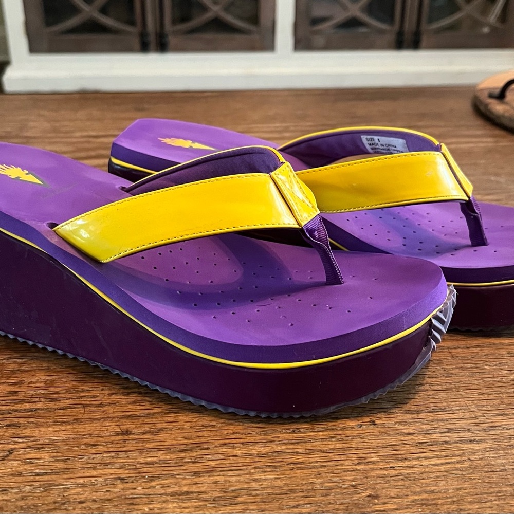 Volatile Purple and Yellow Platform Flip Flops